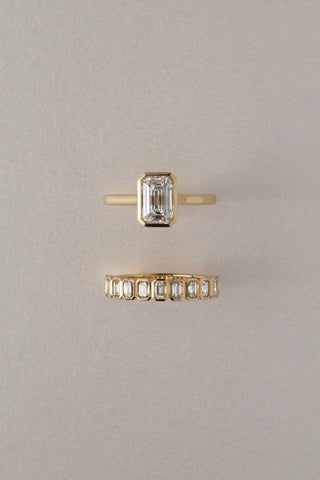 Eliza 18k yellow gold 0.90ct emerald cut lab-grown diamond bezel wedding ring, D-E colour, VVS clarity