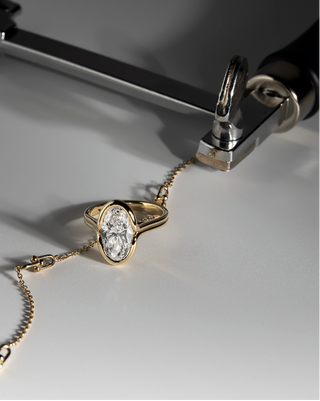 Moval Bezel Set Yellow Gold Diamond Engagement Ring