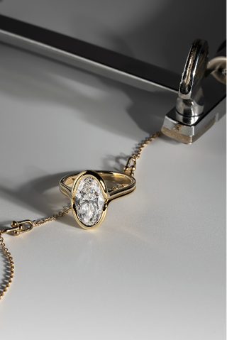 Moval Bezel Set Engagement Ring Yellow Gold