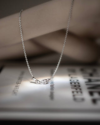 Johanna 9k white gold diamond bar cluster necklace with pear, baguette and round brilliant natural diamonds