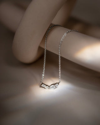 Johanna 9k white gold diamond bar cluster necklace with pear, baguette and round brilliant natural diamonds