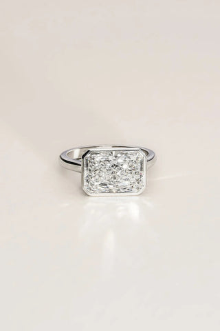Platinum bezel-set ring featuring a 5.08ct long radiant lab-grown diamond, D colour, VVS2 clarity.