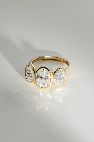 Trilogy Oval Bezel Set Yellow Gold Engagement Ring