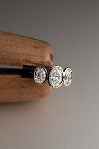 Trilogy Oval Bezel Set Engagement Ring Yellow Gold