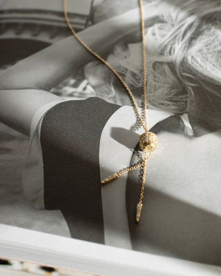 Uri 9k yellow gold lariat necklace with diamond-set barrel and tapered diamond drops